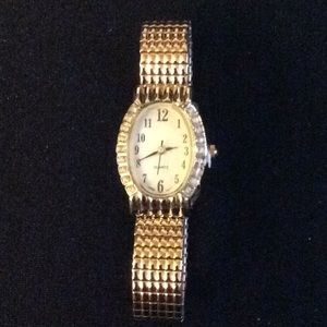 Goldtone Avon expansion band Watch